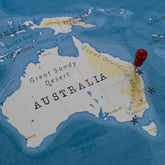 Map of Australia with a red pin on Brisbane